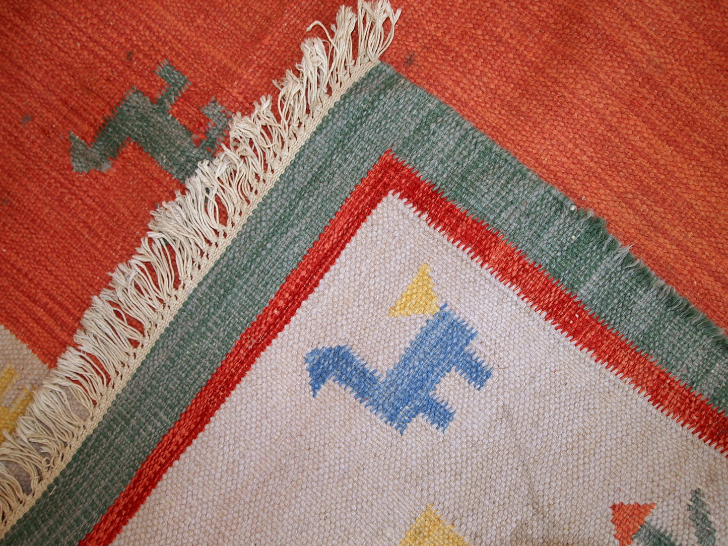 Vintage Persian kilim in bright shades of red, sky blue, beige and yellow. One side of the kilim has some age wear, but generally it is in original good condition.