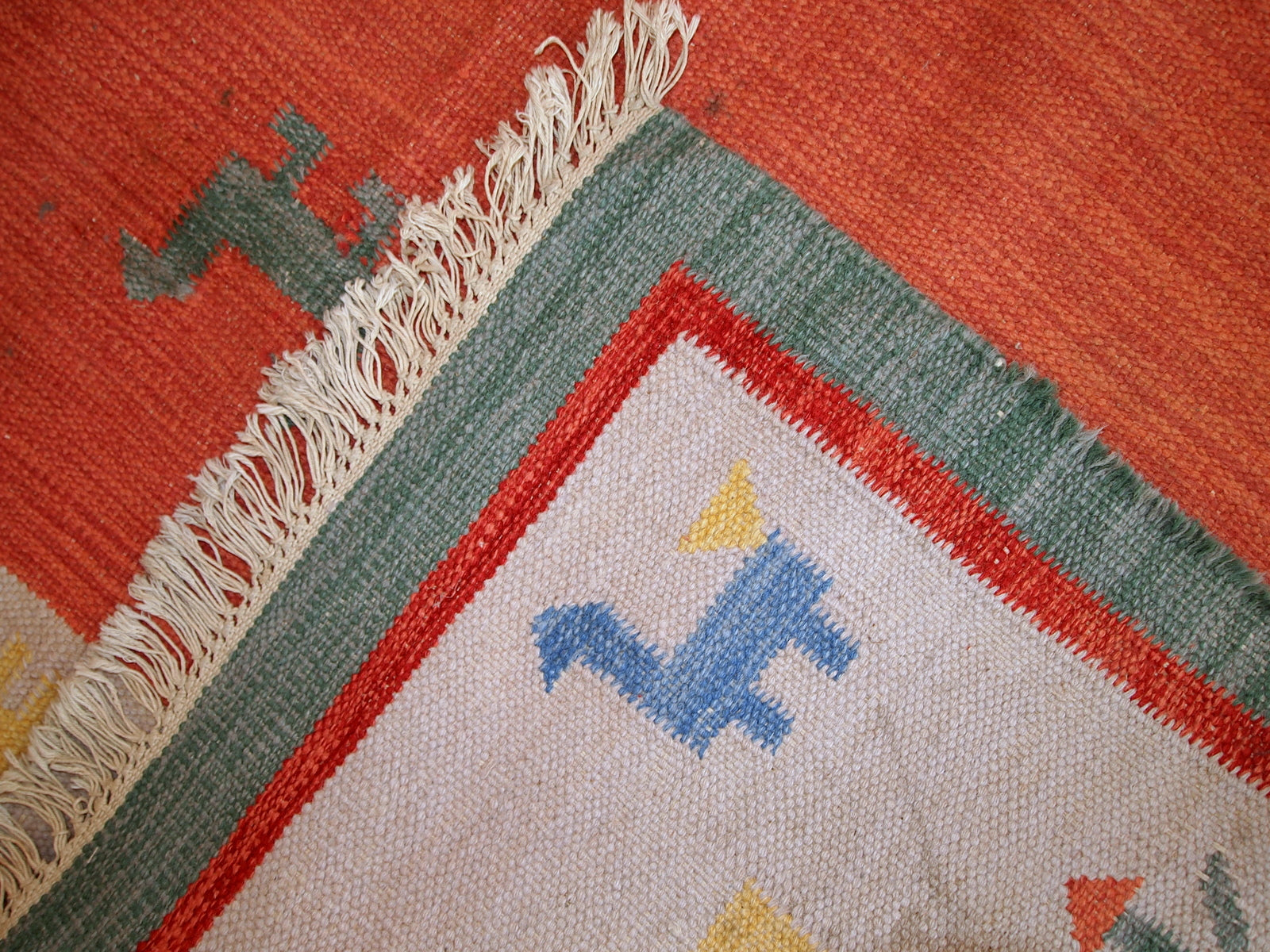 Vintage Persian kilim in bright shades of red, sky blue, beige and yellow. One side of the kilim has some age wear, but generally it is in original good condition.