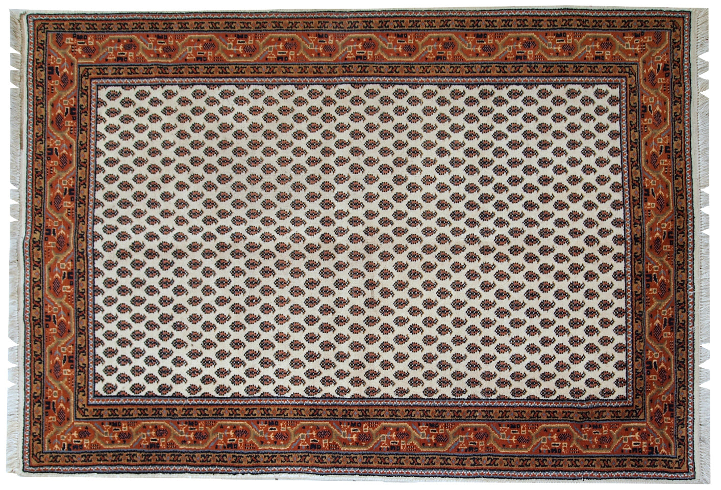 Vintage handmade Indian rug with Seraband design in white shade with rusty border. All-over design with paisley pattern. The rug is from the end of 20th century in original good condition.  