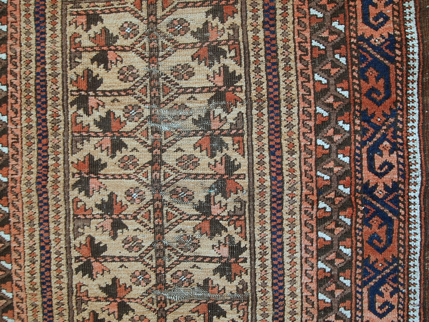This prayer Baluch rug is in original condition, it has some little age wear and old restoration from the back. Light shade of brown on the field and red decorations. The border has beautiful tribal design in navy blue, pink and red. 