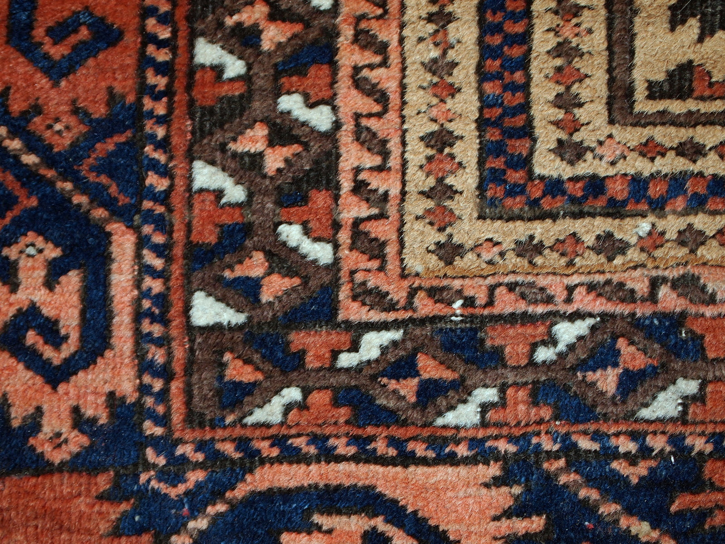 This prayer Baluch rug is in original condition, it has some little age wear and old restoration from the back. Light shade of brown on the field and red decorations. The border has beautiful tribal design in navy blue, pink and red. 