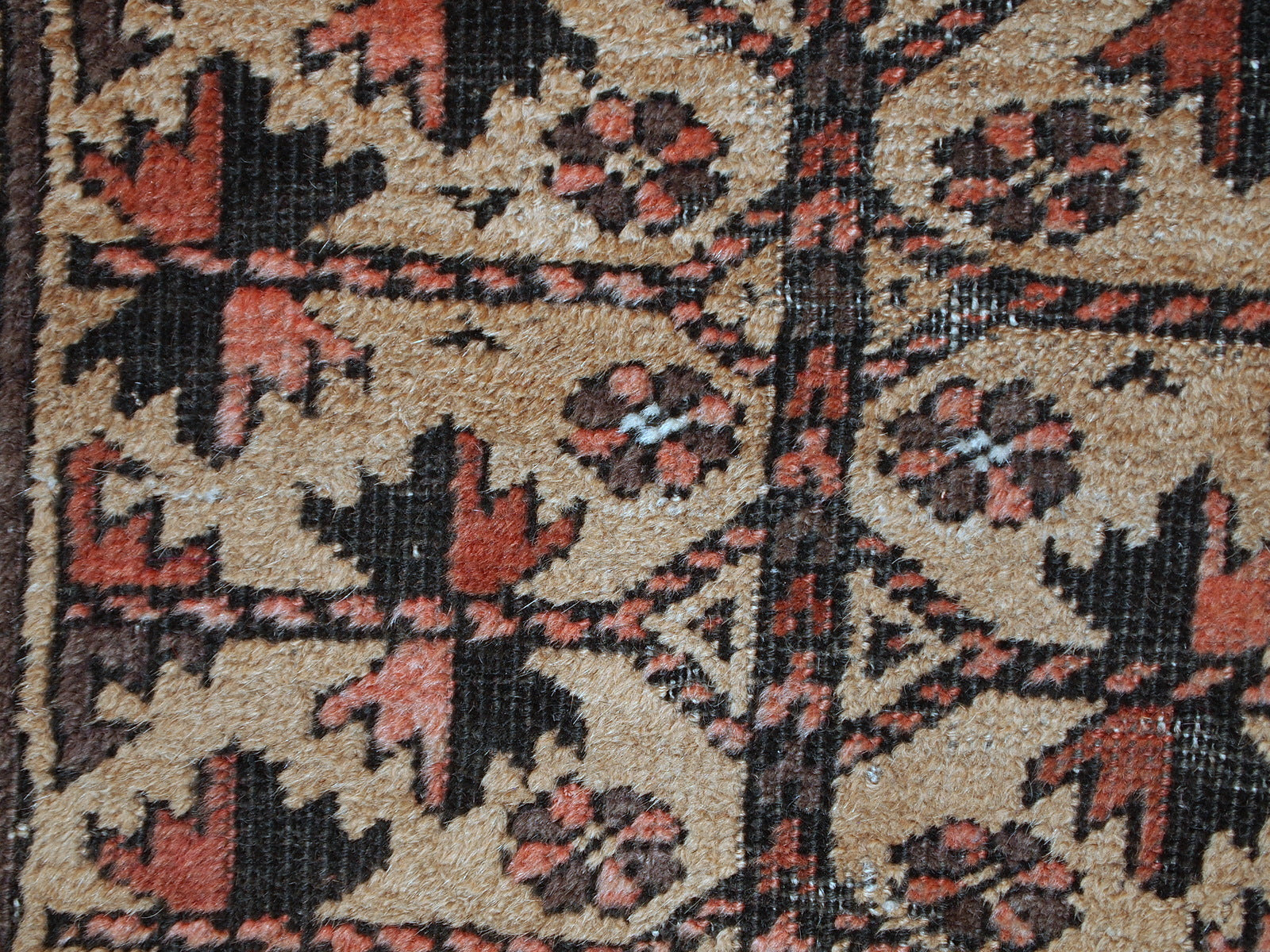 This prayer Baluch rug is in original condition, it has some little age wear and old restoration from the back. Light shade of brown on the field and red decorations. The border has beautiful tribal design in navy blue, pink and red. 