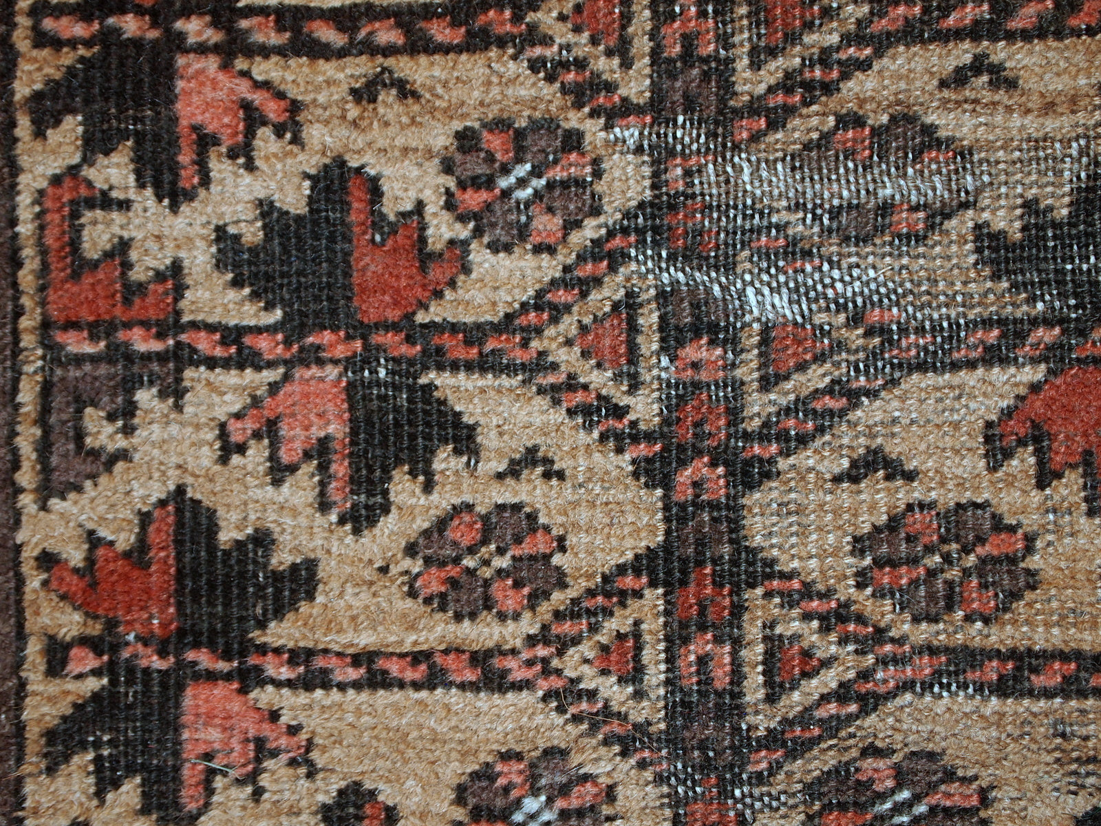 This prayer Baluch rug is in original condition, it has some little age wear and old restoration from the back. Light shade of brown on the field and red decorations. The border has beautiful tribal design in navy blue, pink and red. 