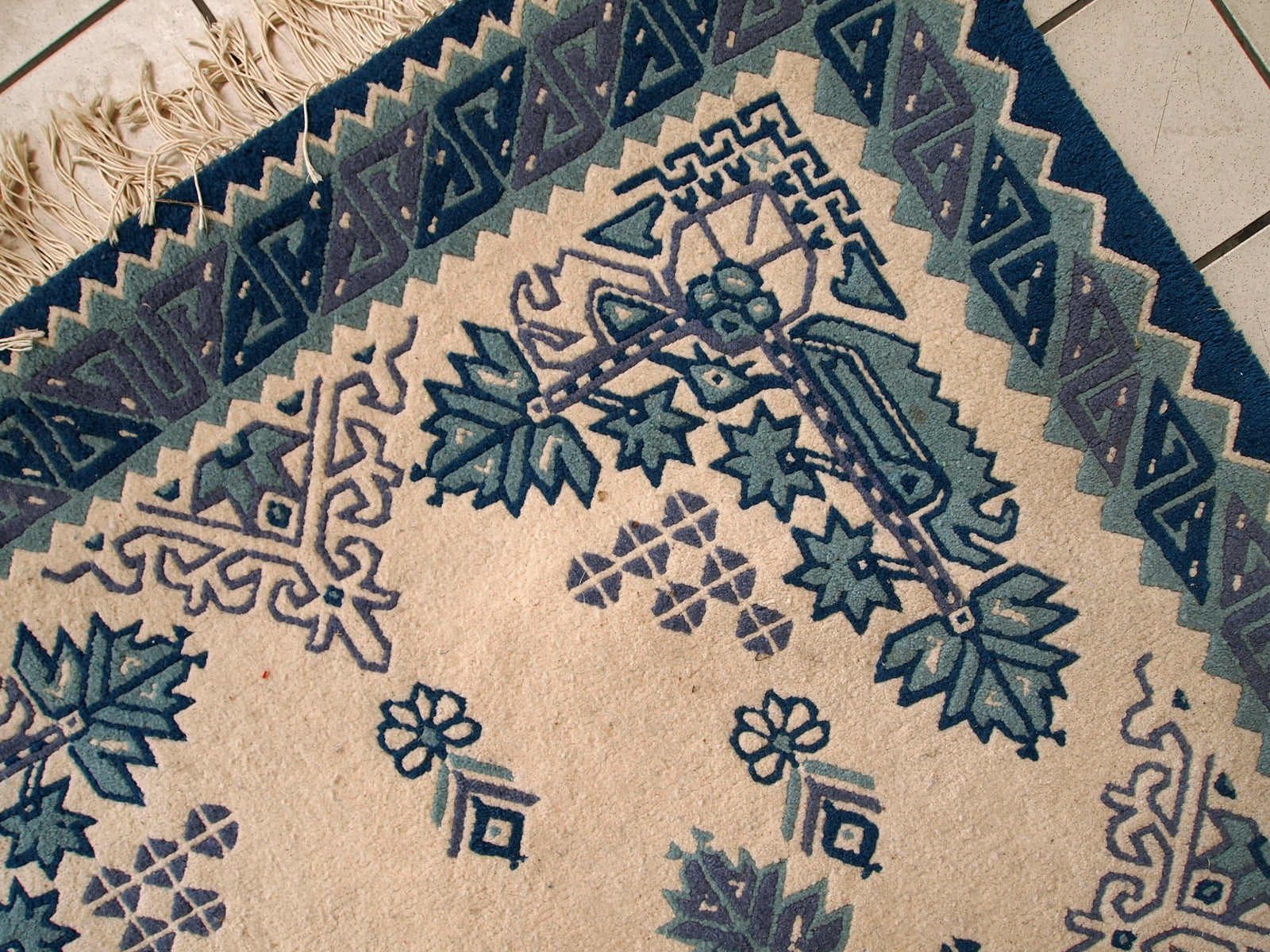 Vintage Tunisian handmade rug in blue and white shades. The rug is from the middle of 20th century, made out of wool. It is in tribal design and in original good condition.