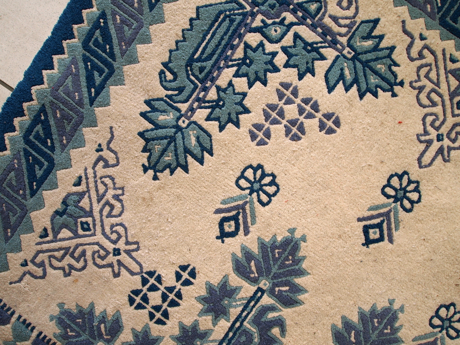 Vintage Tunisian handmade rug in blue and white shades. The rug is from the middle of 20th century, made out of wool. It is in tribal design and in original good condition.