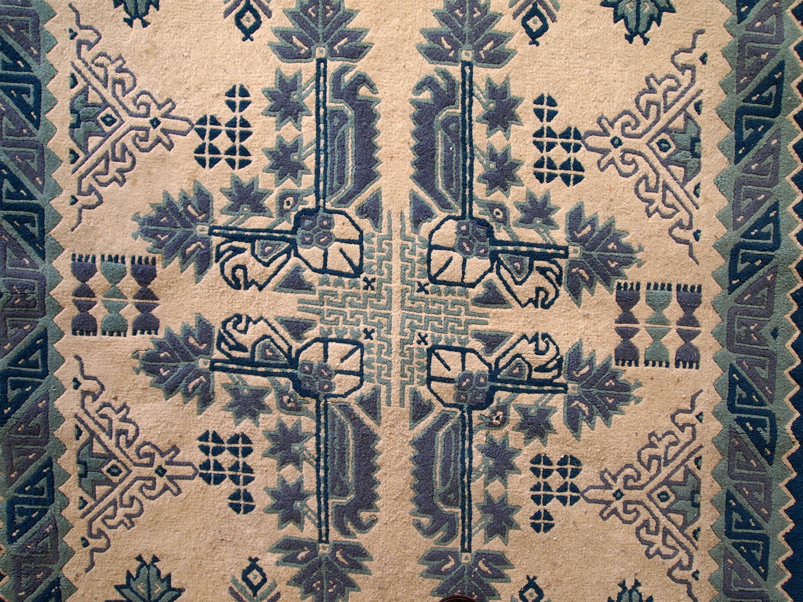 Vintage Tunisian handmade rug in blue and white shades. The rug is from the middle of 20th century, made out of wool. It is in tribal design and in original good condition.