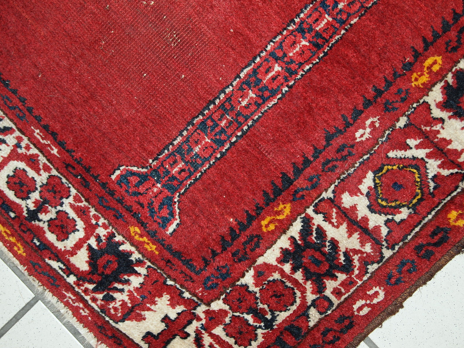 Vintage handmade Turkish prayer rug in bright red shade with yellow, white and navy blue details. The rug is in original condition, it has some low pile. Made out of soft wool. 