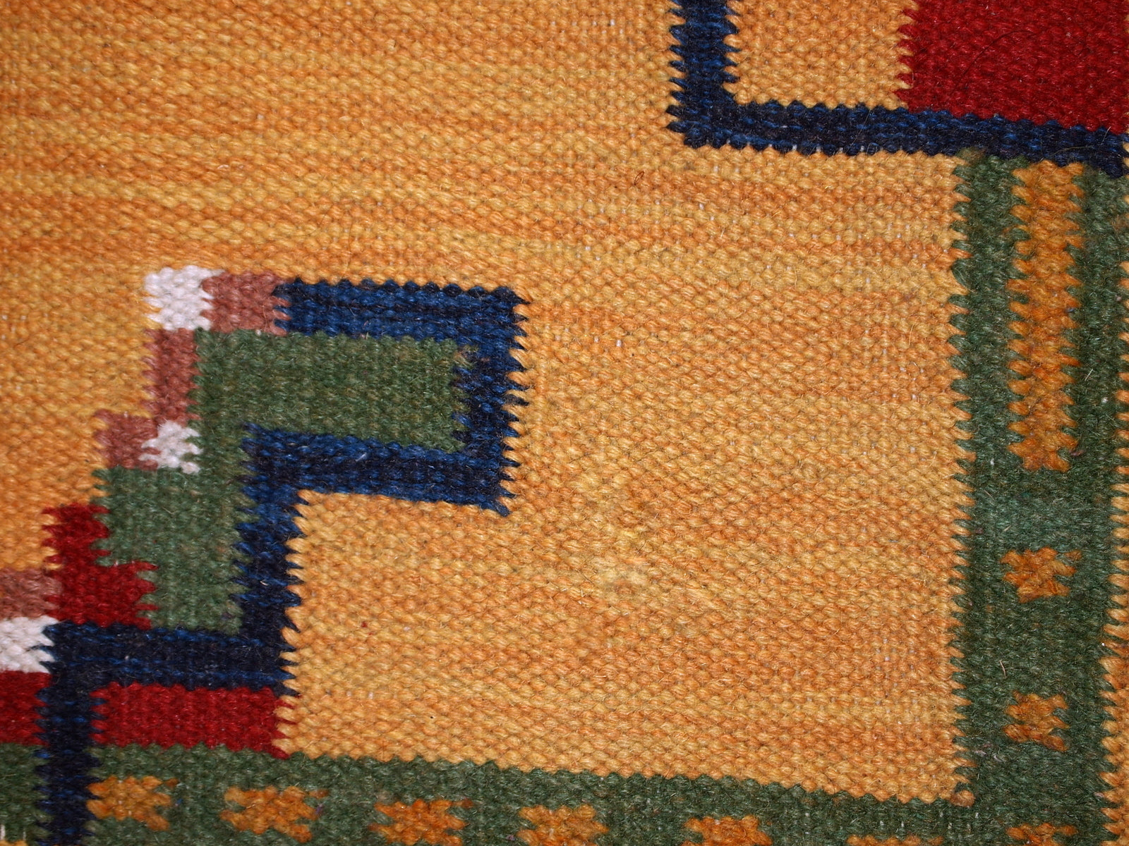 Vintage handmade Persian Gabbeh kilim in original condition. The rug is in yellow shad with minimal abstract design on it. It is made in wool.