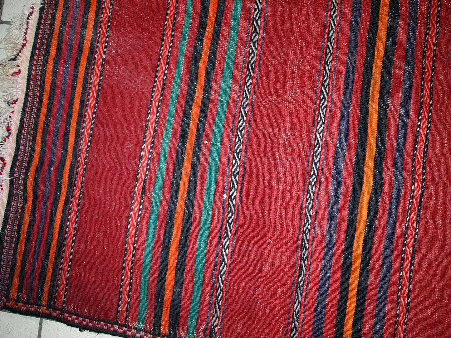 Handmade vintage Persian kilim in red shade with stripes. This kilim is in original condition, has some signs of age.