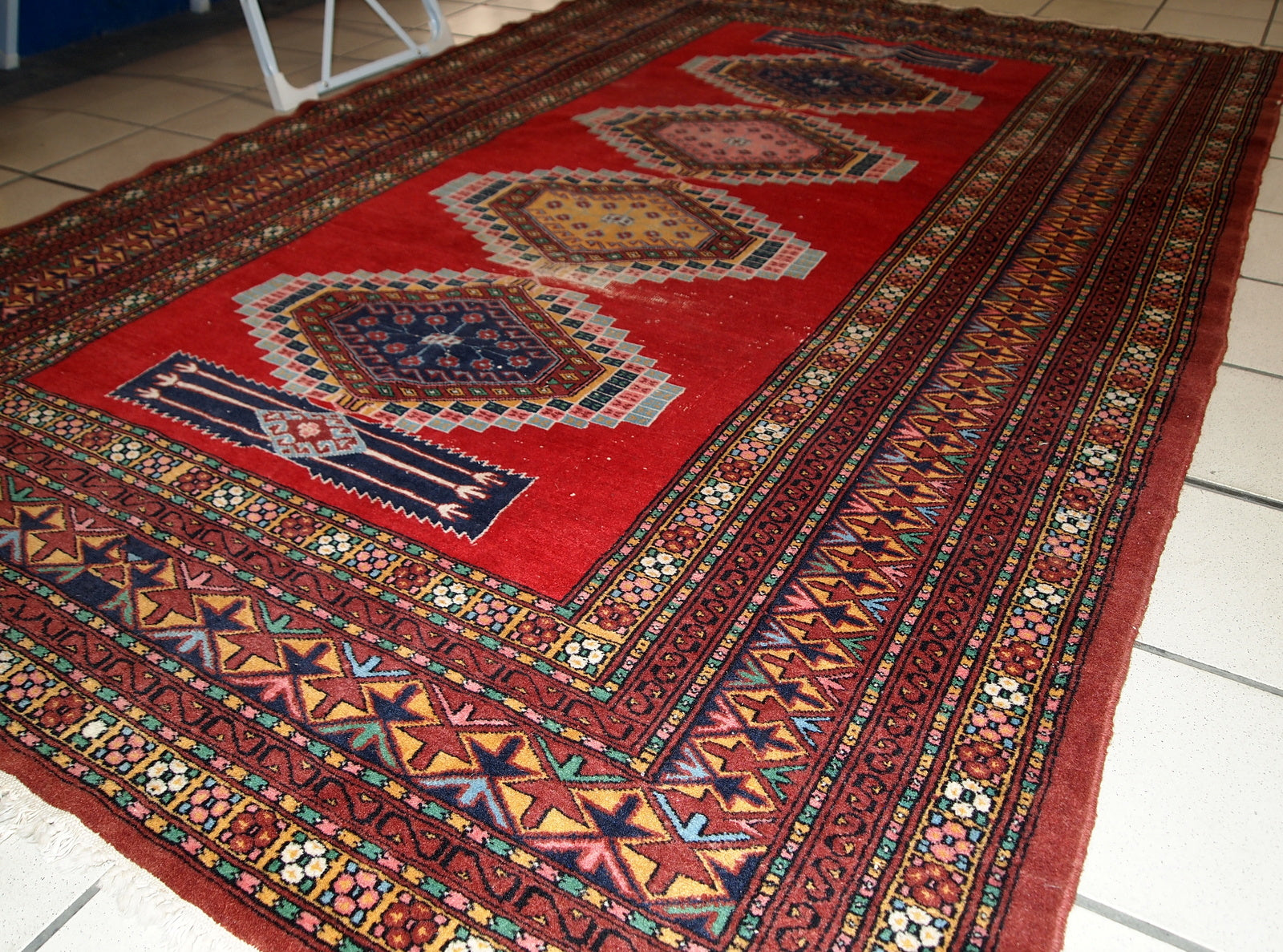 Handmade vintage distressed Uzbek Bukhara rug, 1960s