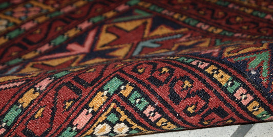 Handmade vintage distressed Uzbek Bukhara rug, 1960s