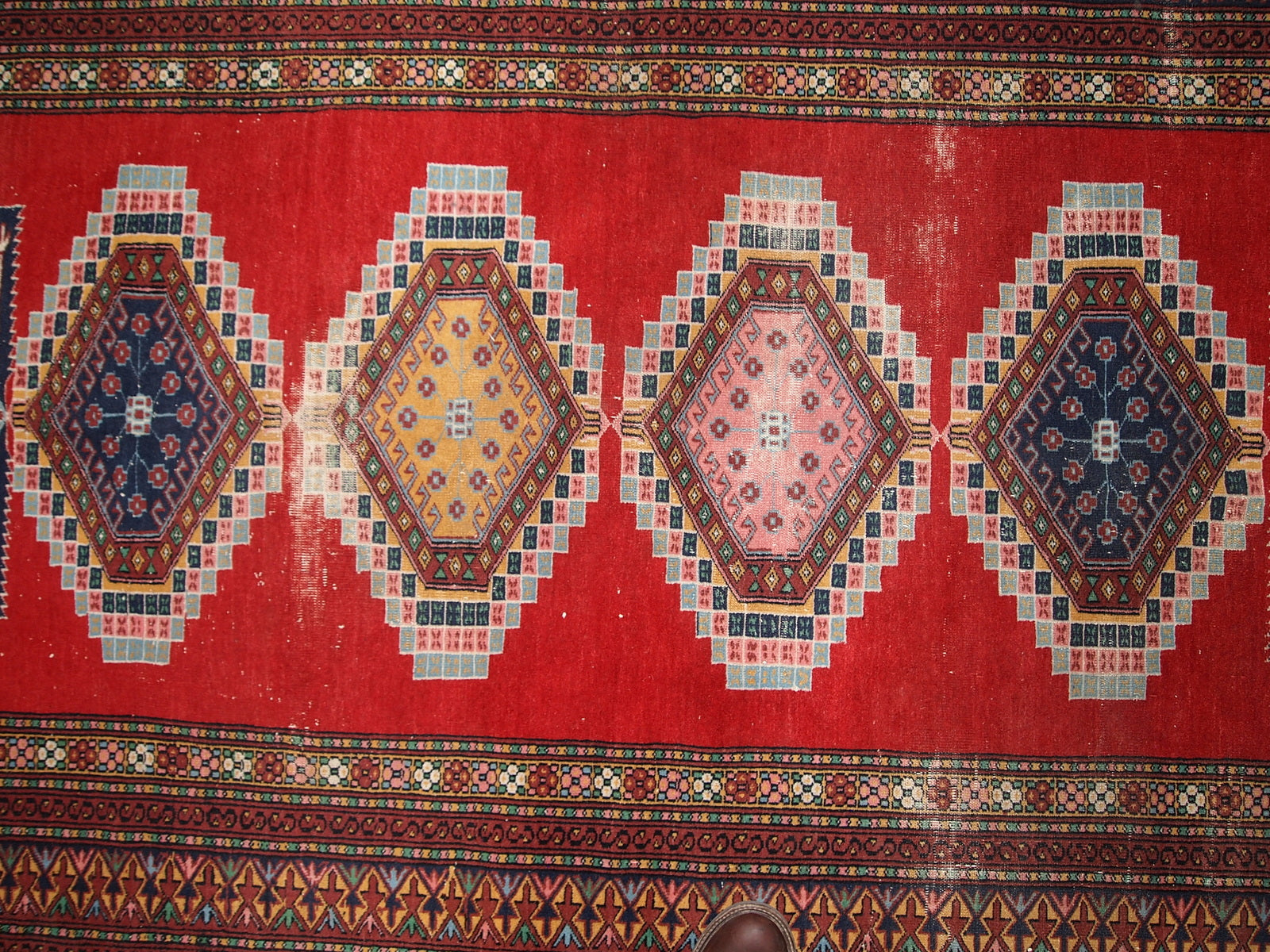 Handmade vintage distressed Uzbek Bukhara rug, 1960s