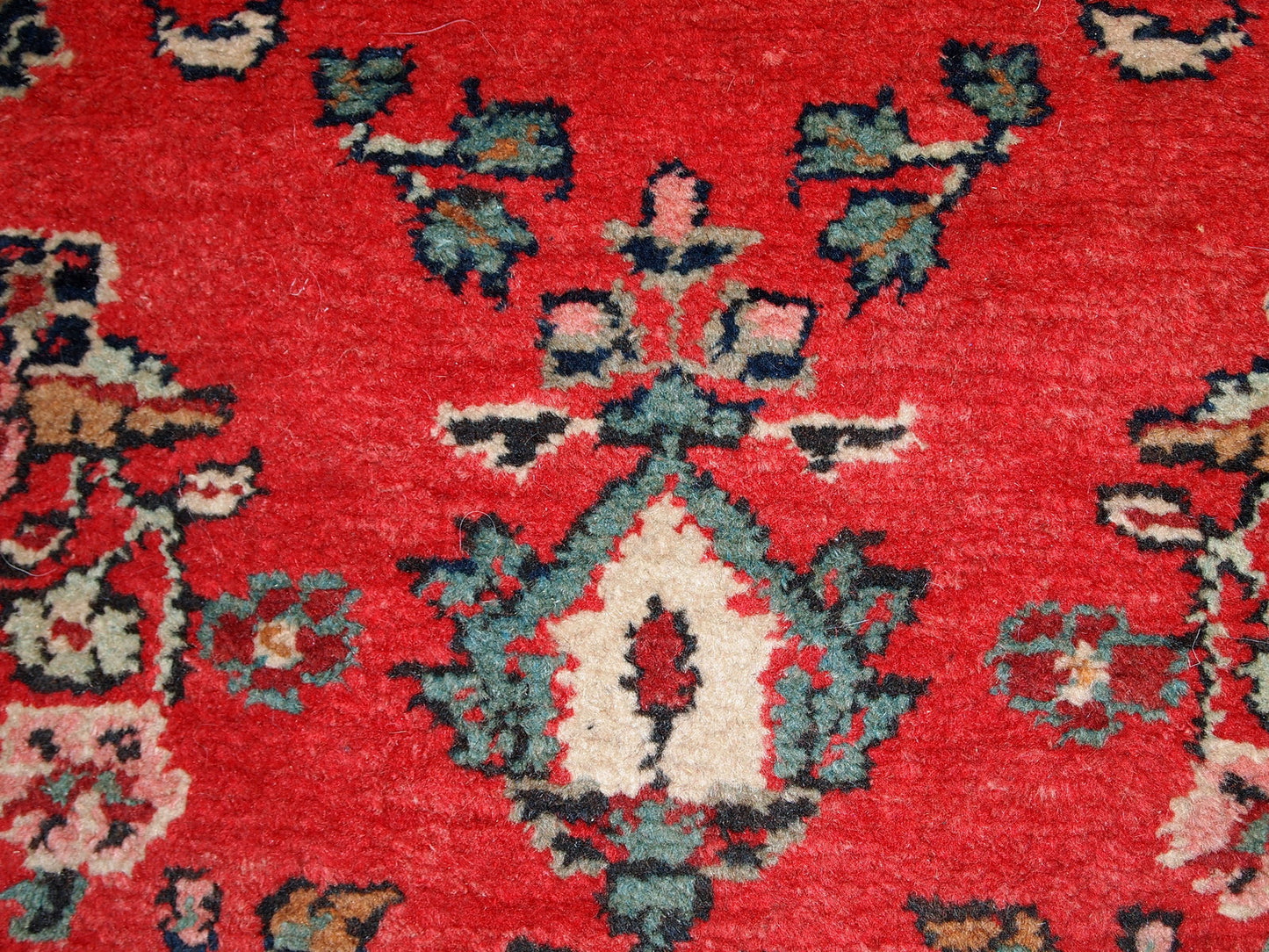 Handmade vintage Hamadan runner in red wool. This rug has been made in the middle of 20th century in Middle East region.
