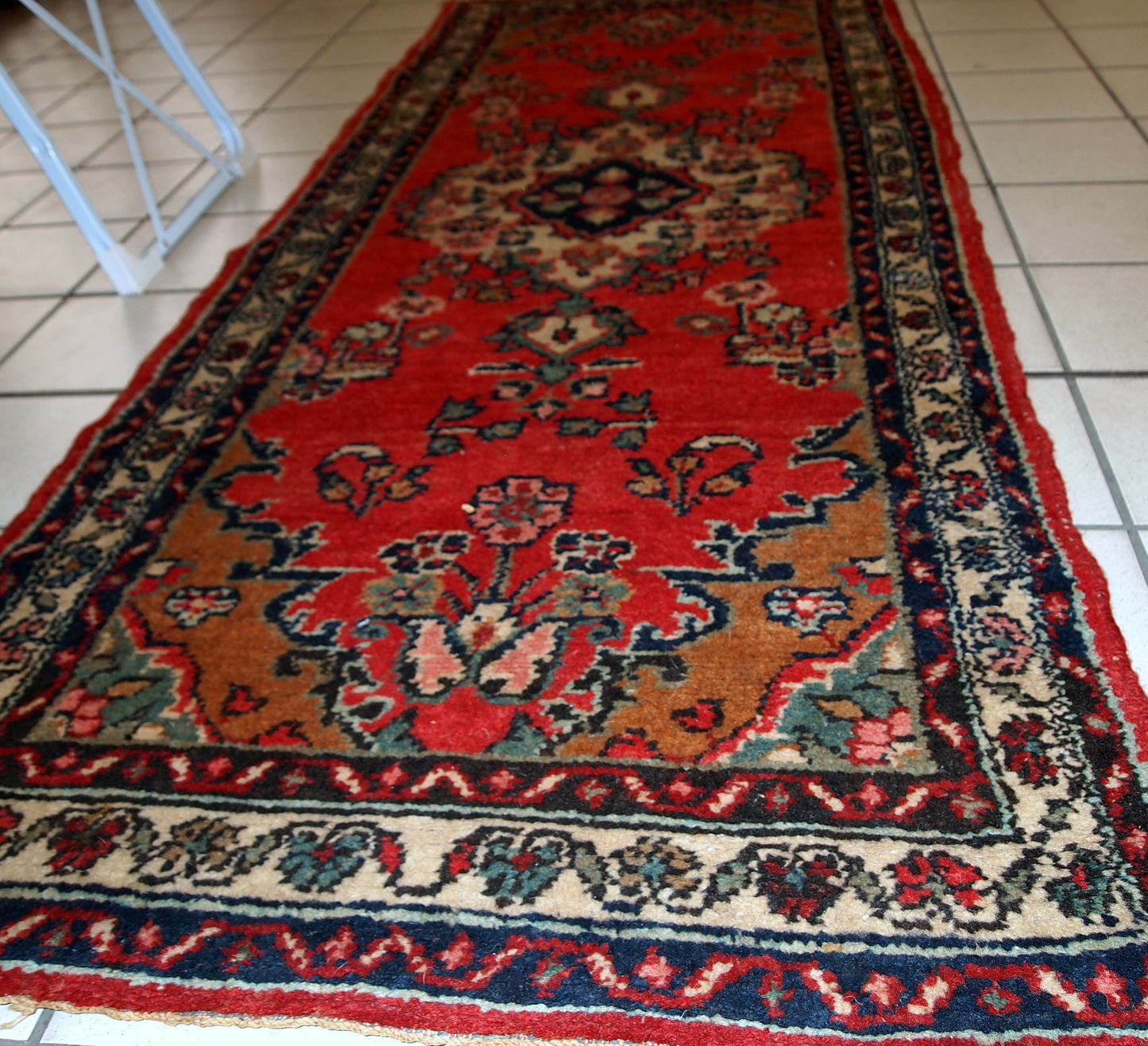 Handmade vintage Hamadan runner in red wool. This rug has been made in the middle of 20th century in Middle East region.