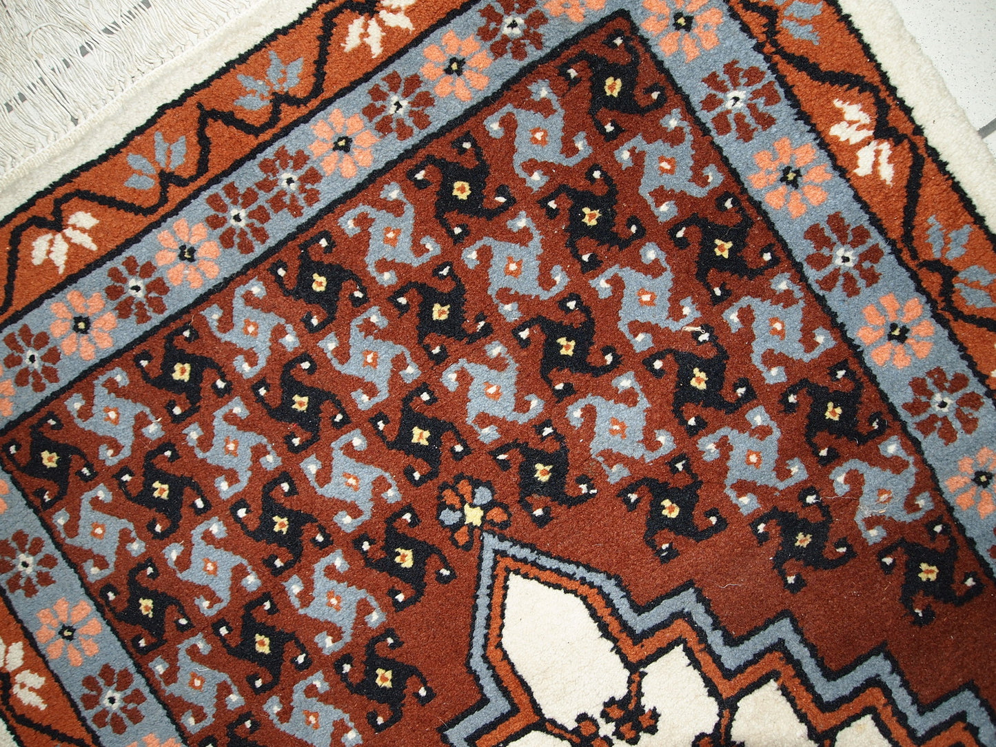 Vintage Berber rug from Morocco in original good condition. The rug made in the end of 20th century in wool.