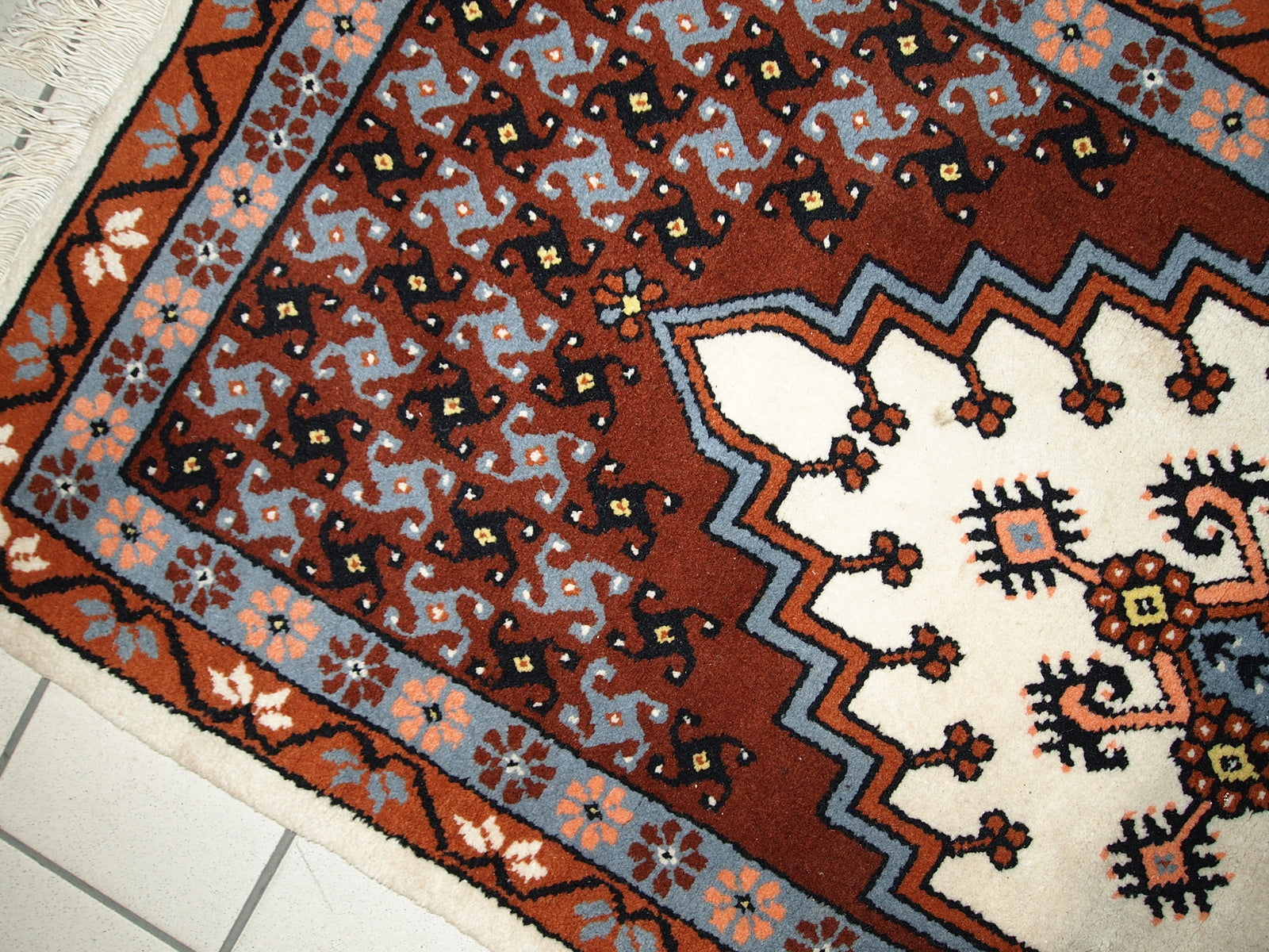 Vintage Berber rug from Morocco in original good condition. The rug made in the end of 20th century in wool.