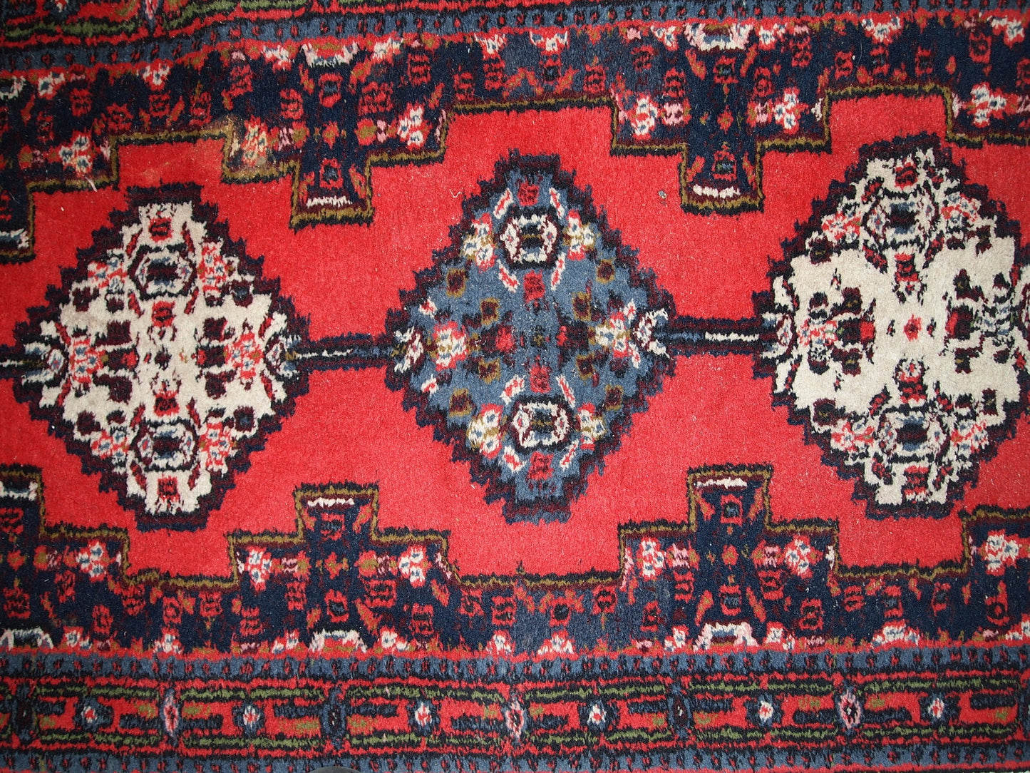 Handmade vintage Persian Hamadan rug in bright red color. The rug is in original good condition from the end of 20th century.