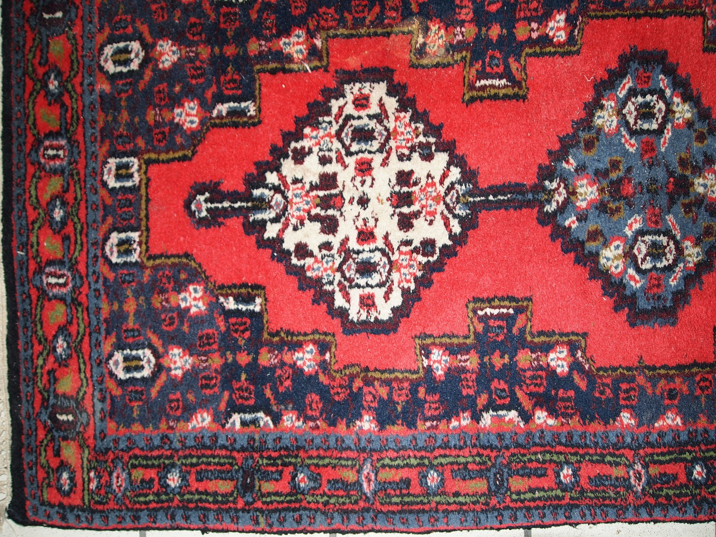 Handmade vintage Persian Hamadan rug in bright red color. The rug is in original good condition from the end of 20th century.