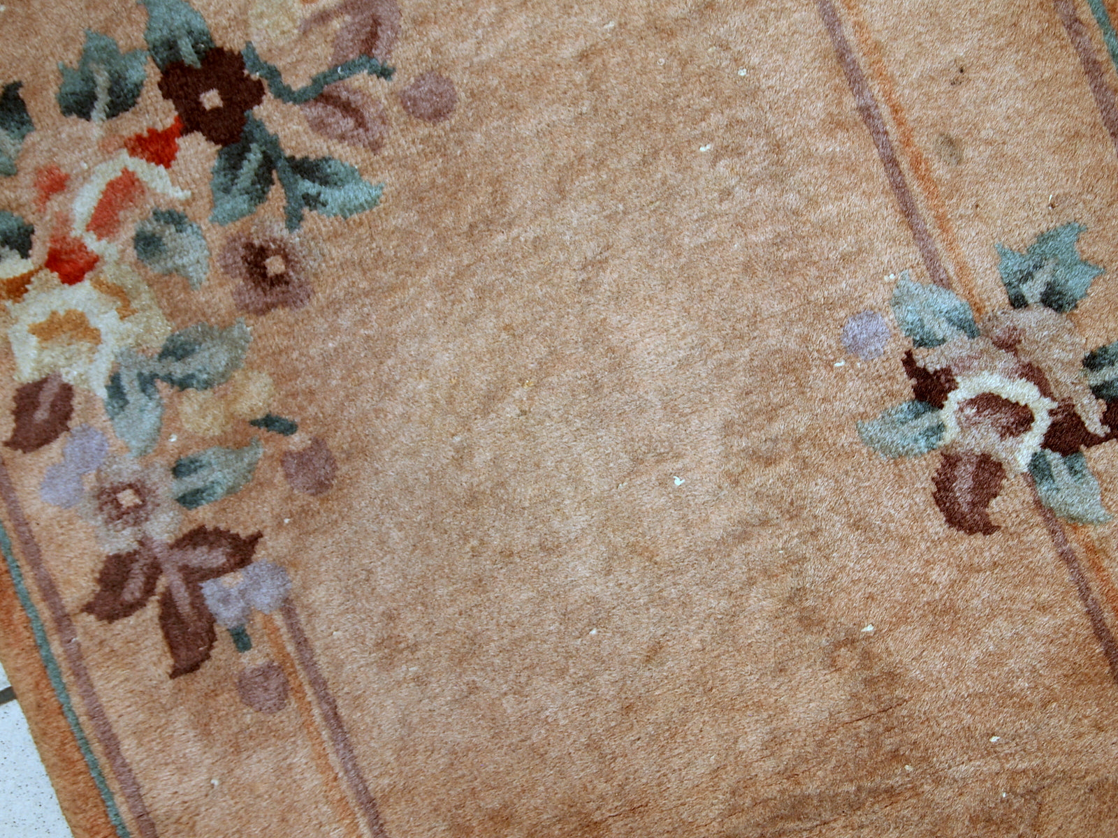 Handmade vintage Art Deco Chinese rug in light brown shade. The rug is from the middle of 20th century in original condition, it has some low pile.