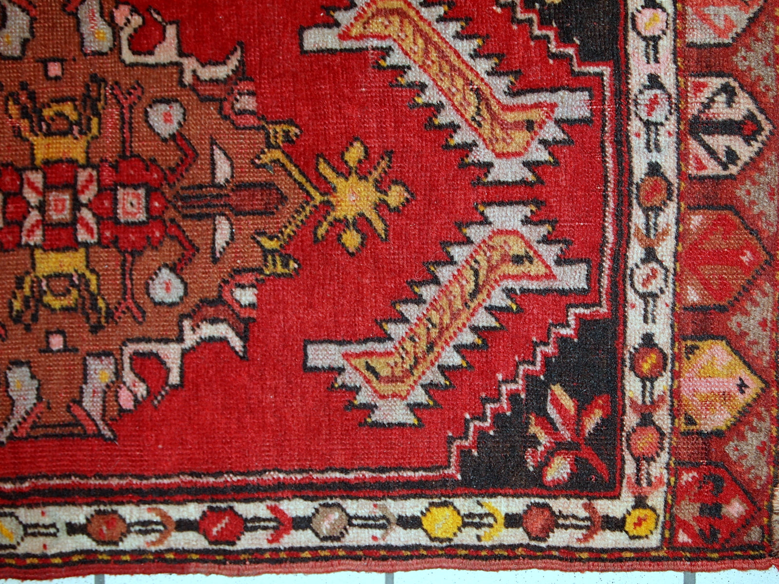 Handmade vintage Turkish Yastik rug in bright red colour. The rug is in original good condition from the middle of 20th century.