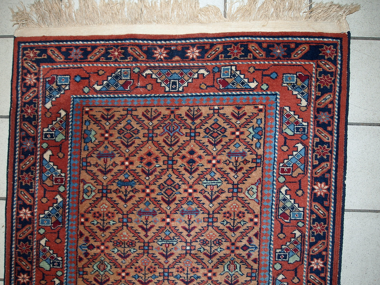 Vintage runner from Middle East in original good condition. It has been made in wool in the middle of 20th century. This runner is machine made.