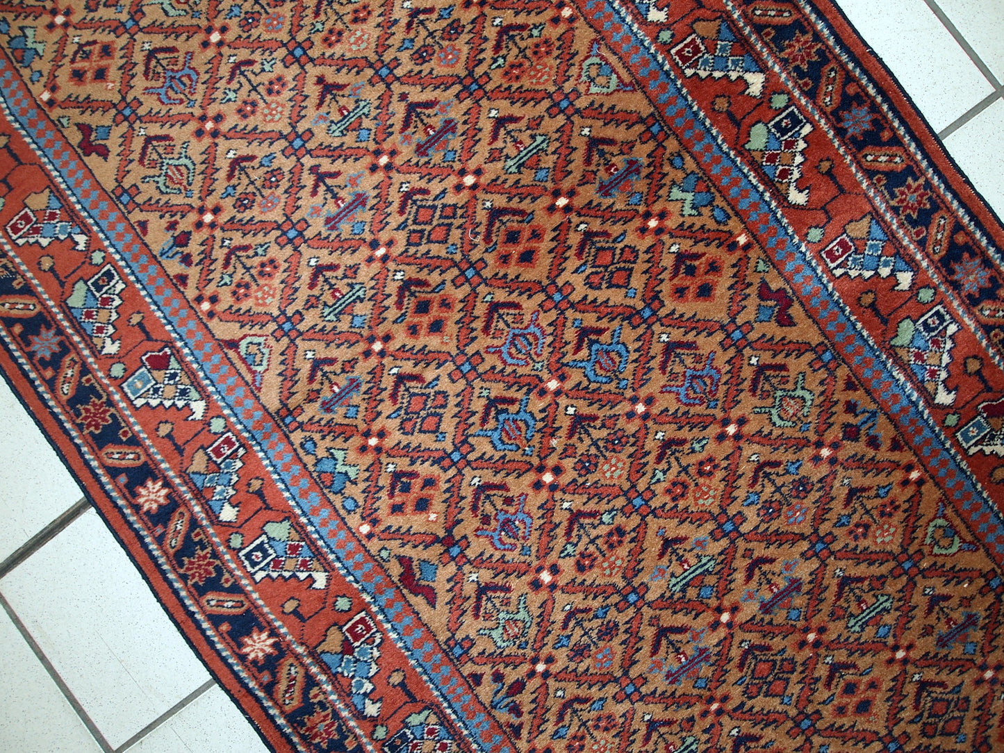 Vintage runner from Middle East in original good condition. It has been made in wool in the middle of 20th century. This runner is machine made.