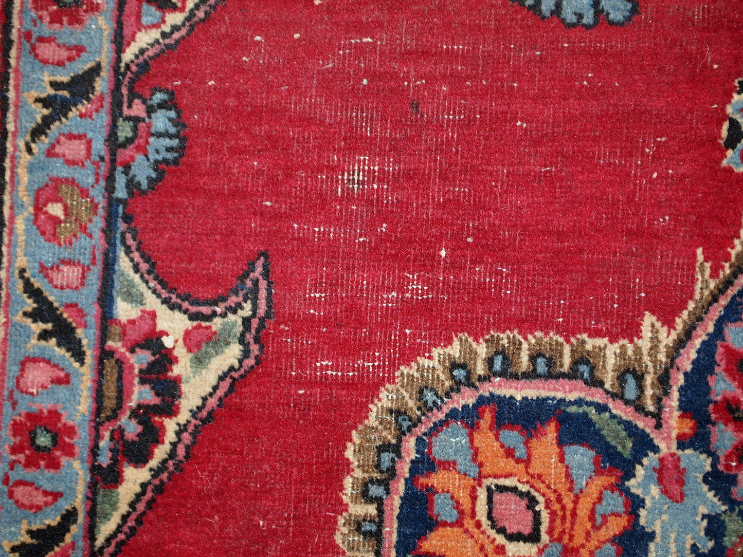 Vintage Persian Kazvin rug in bright red color. The rug is from the end of 20th century. It is in original condition, has some low pile.