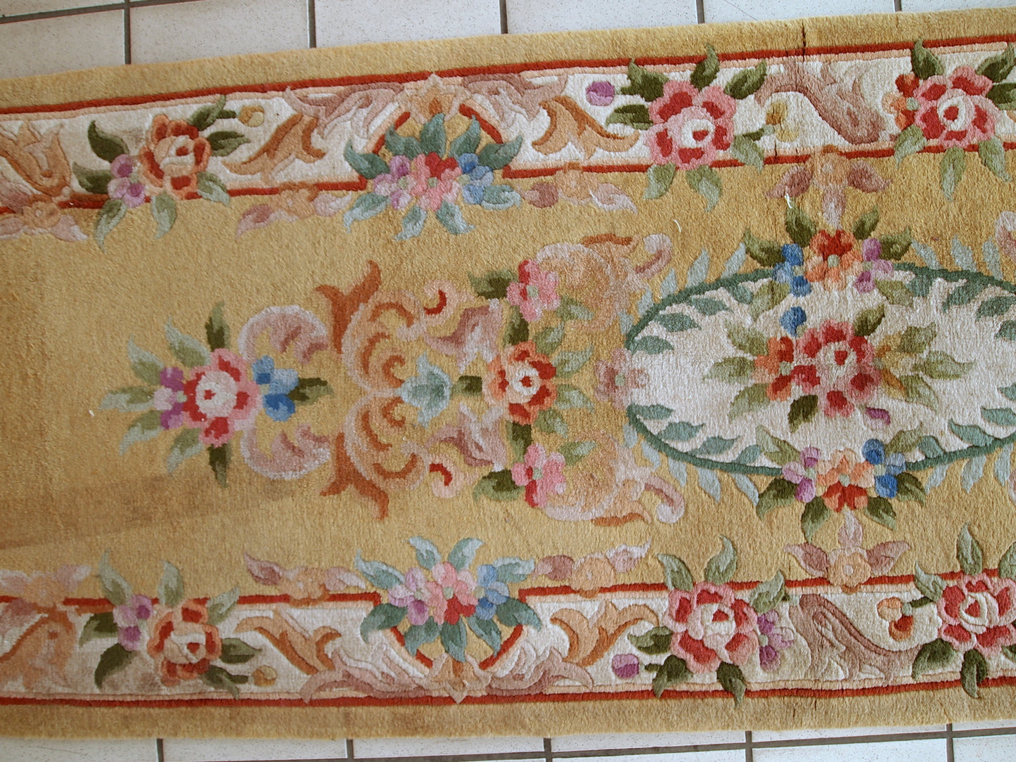 Vintage runner from China made in yellow wool. The rug is from the end of 20th century in original good condition.