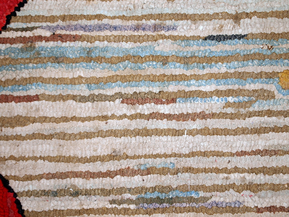 Handmade antique American Hooked rug in floral design. The rug has been made in the beginning of 20th century in USA. It is in original good condition.