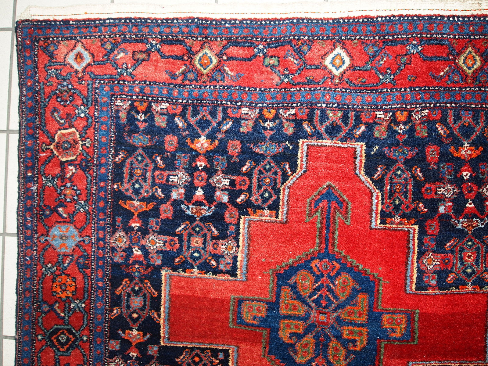 Handmade vintage Persian Senneh rug in original good condition. The rug is from the middle of 20th century, made in wool.