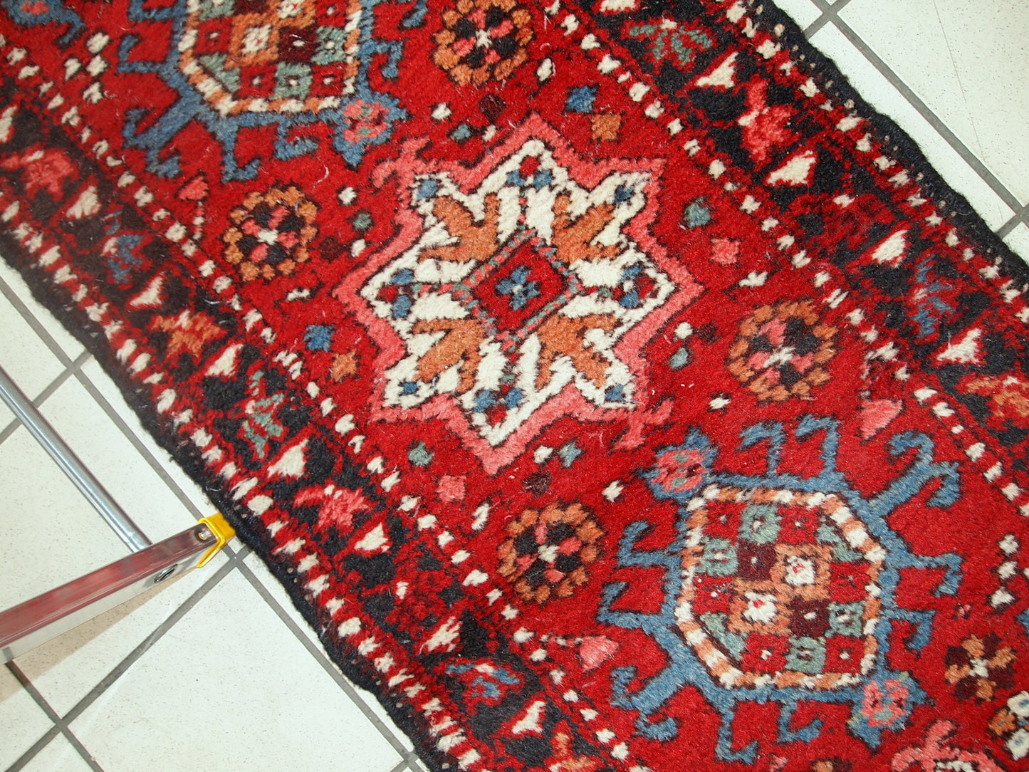Handmade vintage Karajeh narrow runner in original good condition. The rug is from the middle of 20th century made in wool.