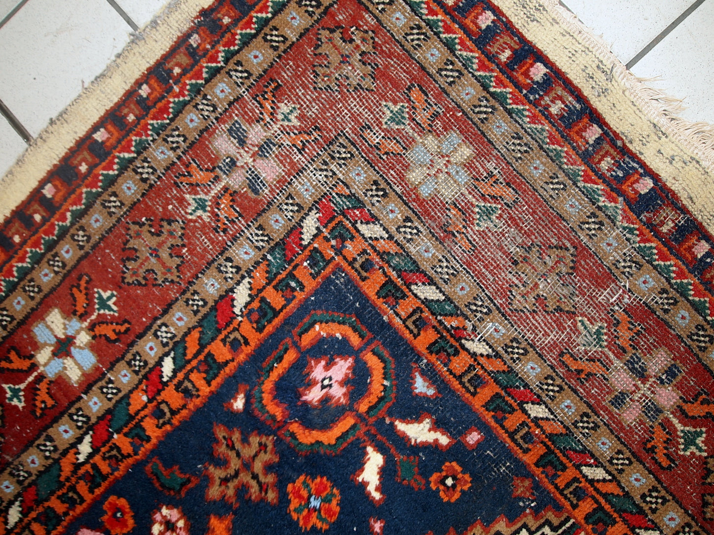 Handmade vintage Hamadan rug in distressed condition ( it has some areas with low pile). The rug is from the end of 20th century made in wool.