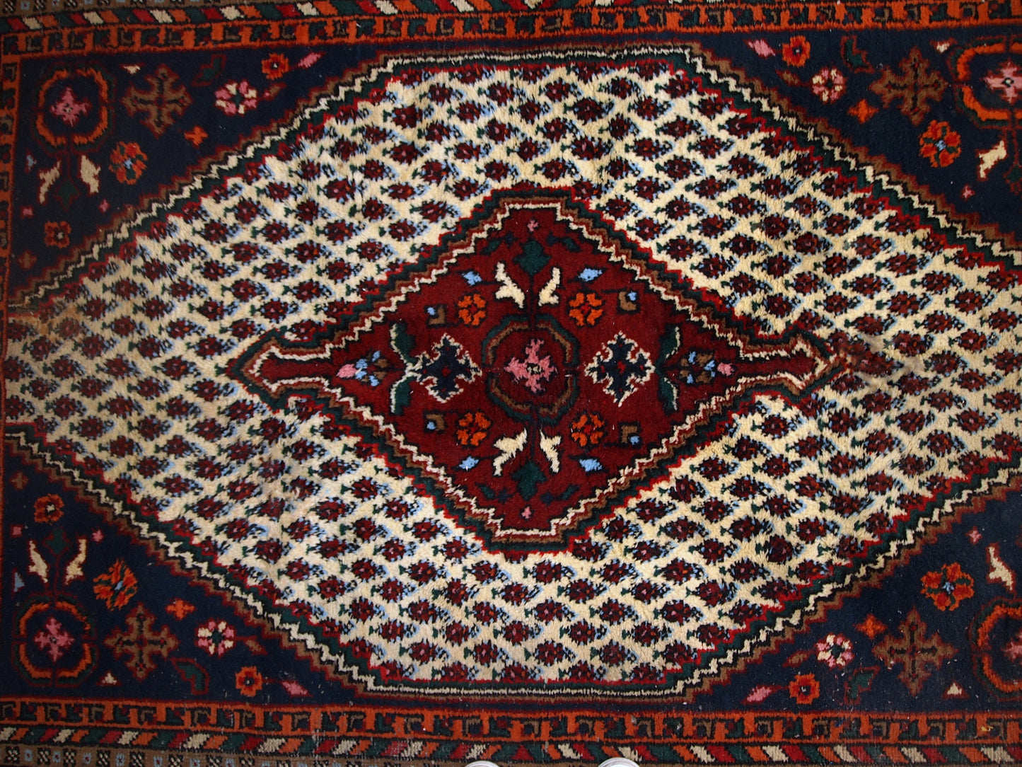 Handmade vintage Hamadan rug in distressed condition ( it has some areas with low pile). The rug is from the end of 20th century made in wool.