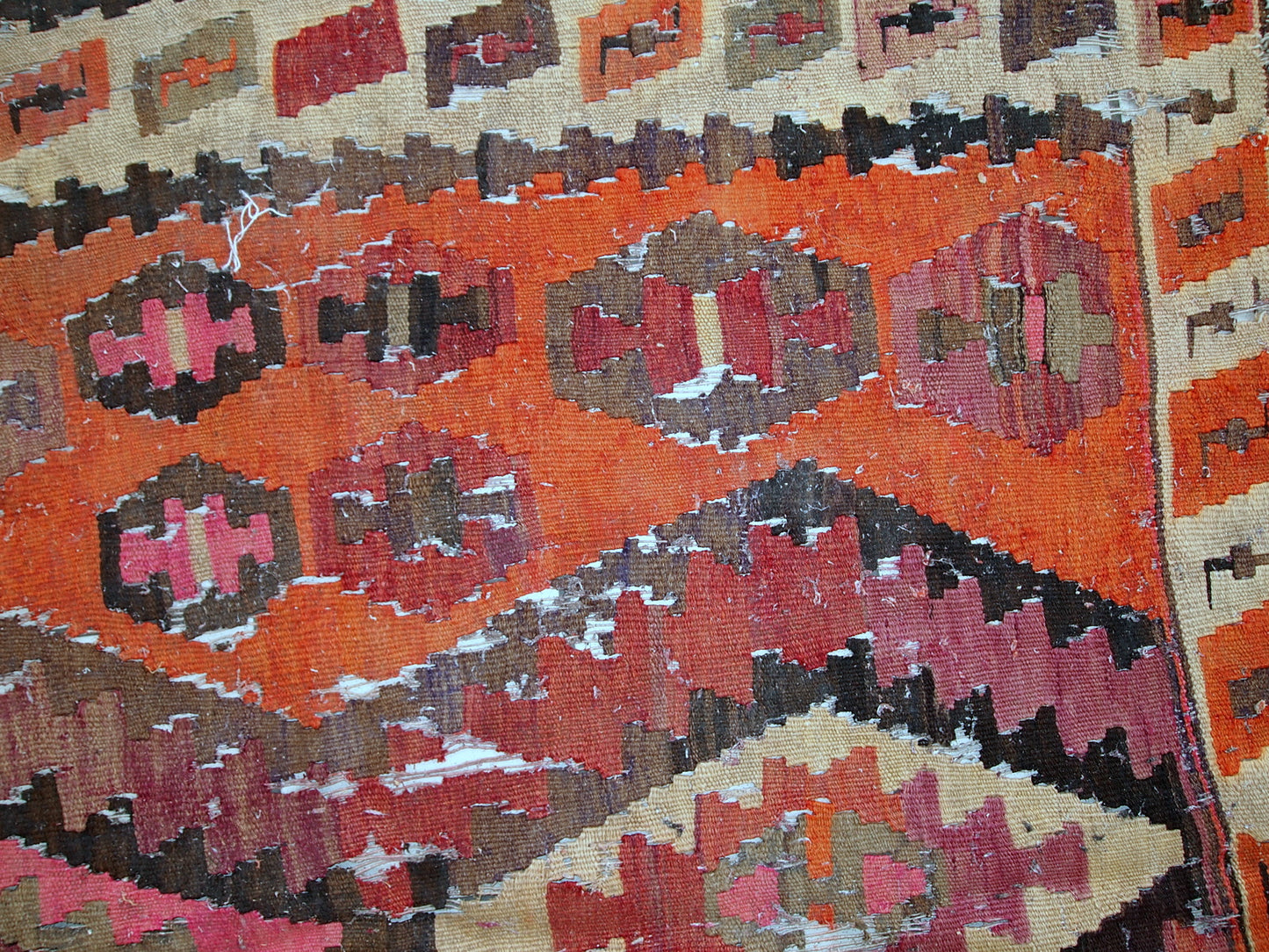 Handmade antique flat-weave from Afghanistan in distressed condition. The rug is from the beginning of 20th century.