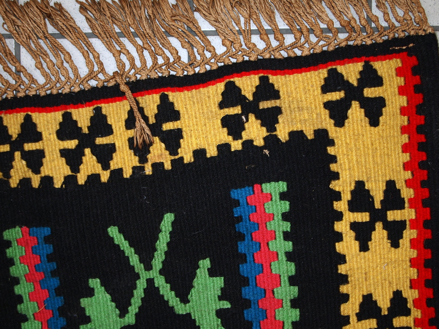 Handmade vintage prayer Turkish Anatolian flat-weave made in black, yellow, green and blue colors. The rug is in original good condition, it is not even ( a little crooked) due to be handwoven.