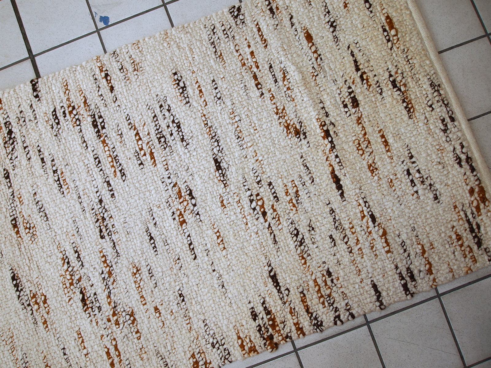 Handmade vintage Indian beige runner in wool. It is very soft. The rug is in original good condition.