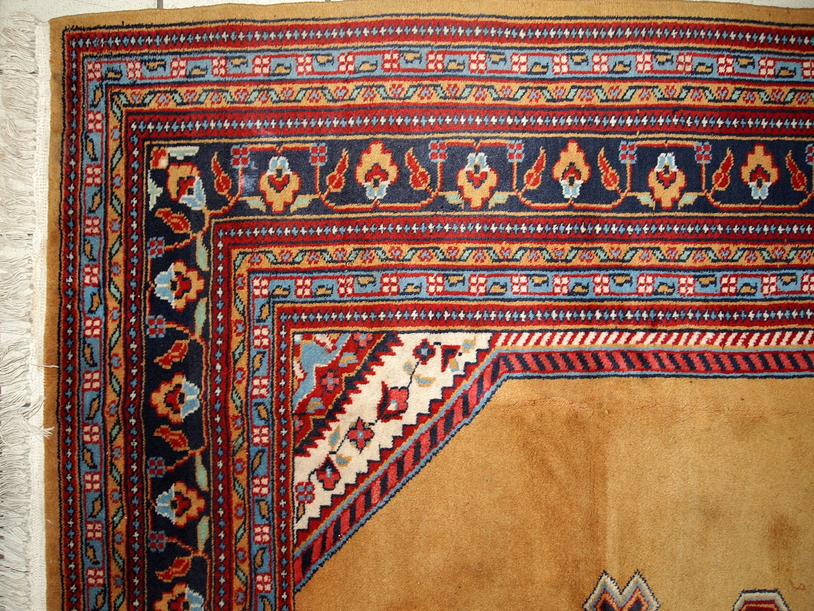 Vintage Uzbek Bukhara rug in original good condition from the middle of 20th century. The rug has been made in yellow wool. 