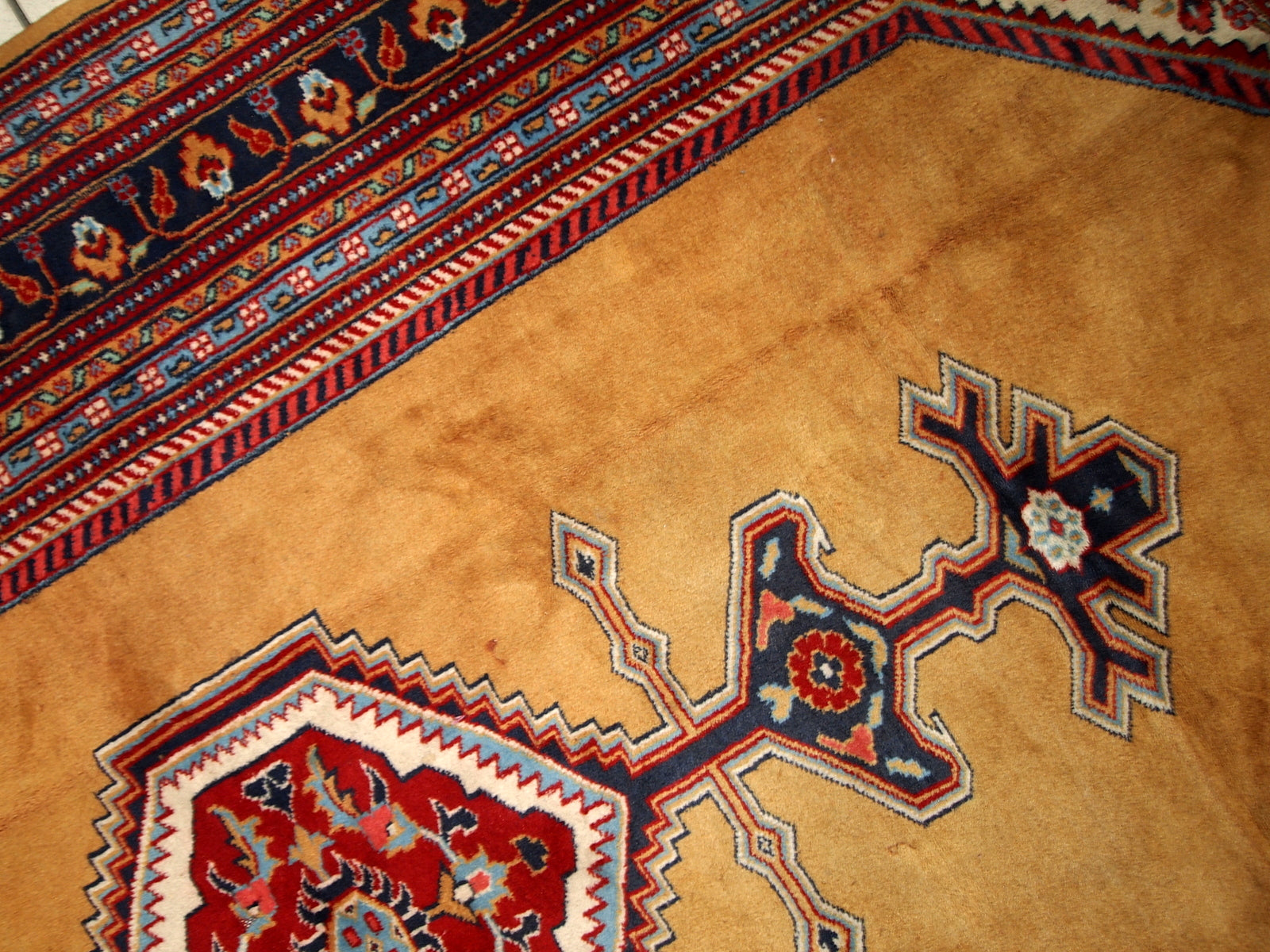Vintage Uzbek Bukhara rug in original good condition from the middle of 20th century. The rug has been made in yellow wool. 