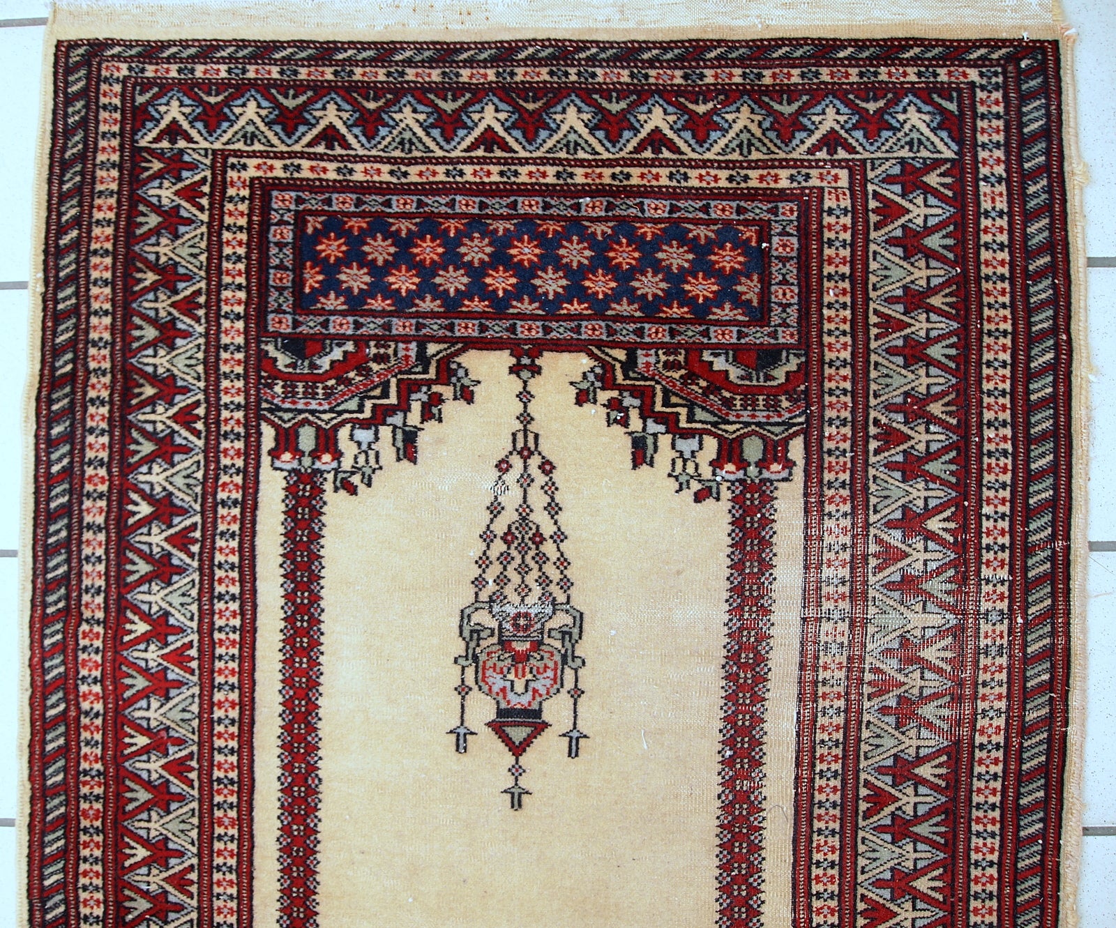 Vintage handmade Pakistani Lahore rug in original condition, it has some low pile due to age. The rug made in wool in the middle of 20th century.