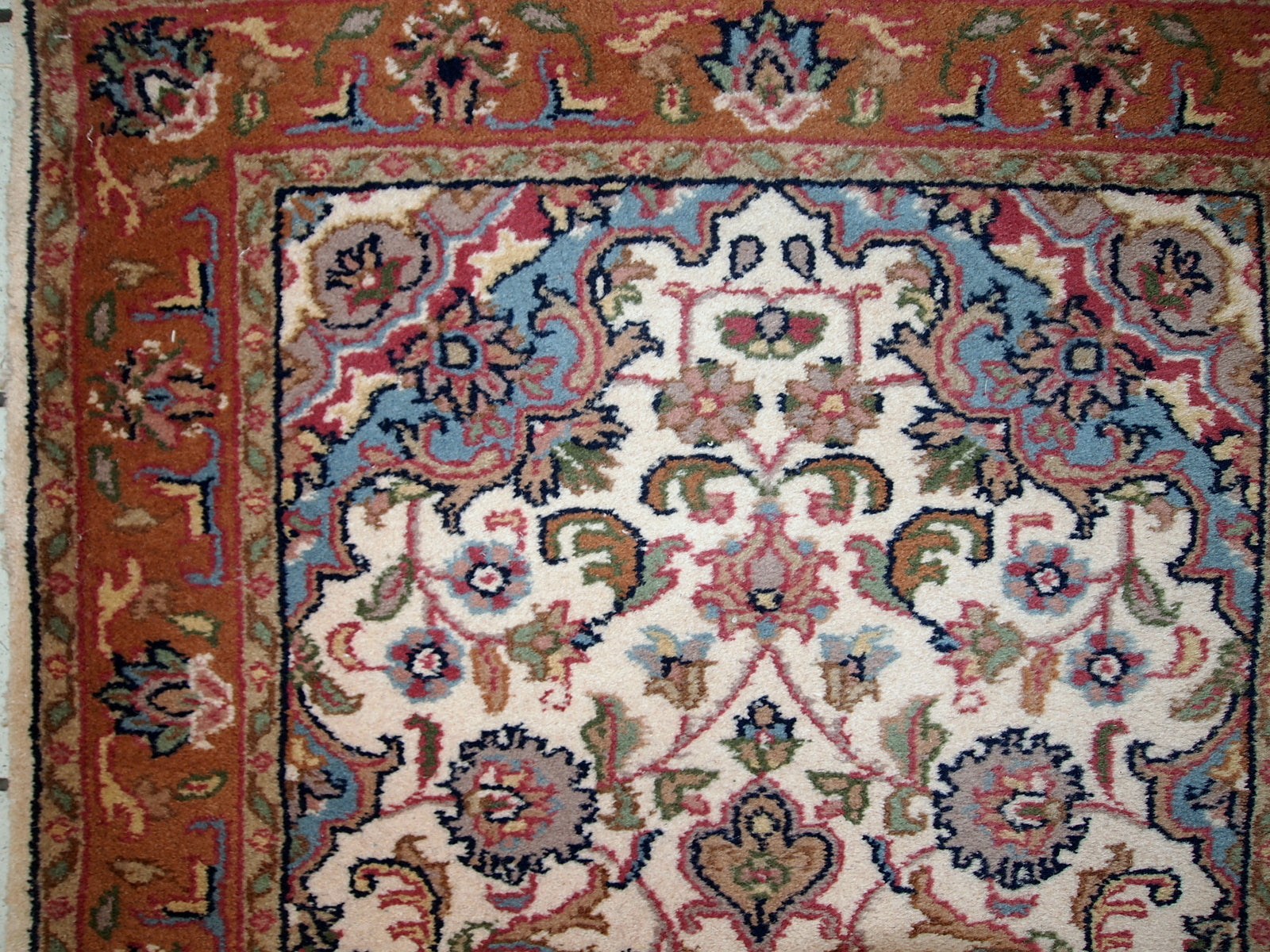 Vintage Indo-Tabriz rug in original good condition. This rug has been made in the middle of 20th century in India.