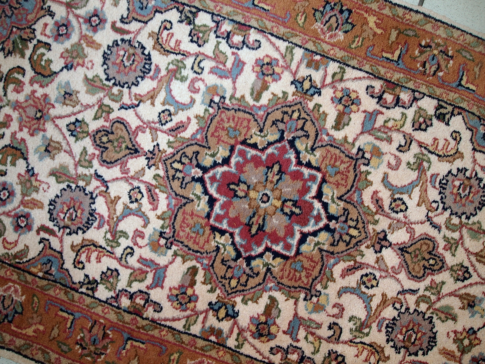 Vintage Indo-Tabriz rug in original good condition. This rug has been made in the middle of 20th century in India.
