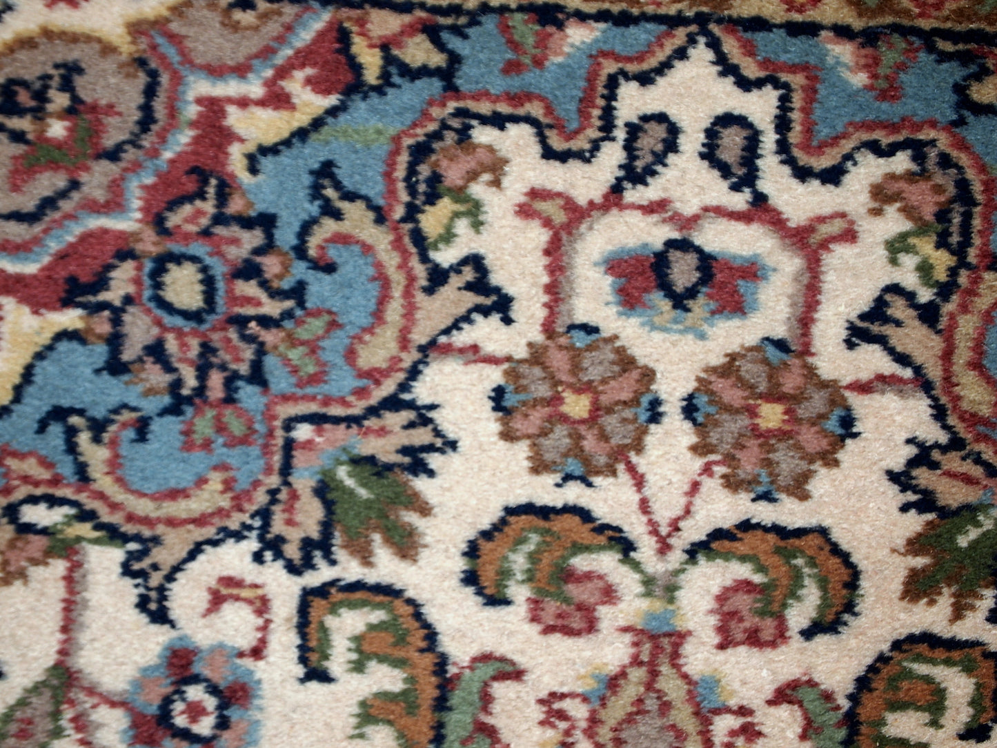 Vintage Indo-Tabriz rug in original good condition. This rug has been made in the middle of 20th century in India.