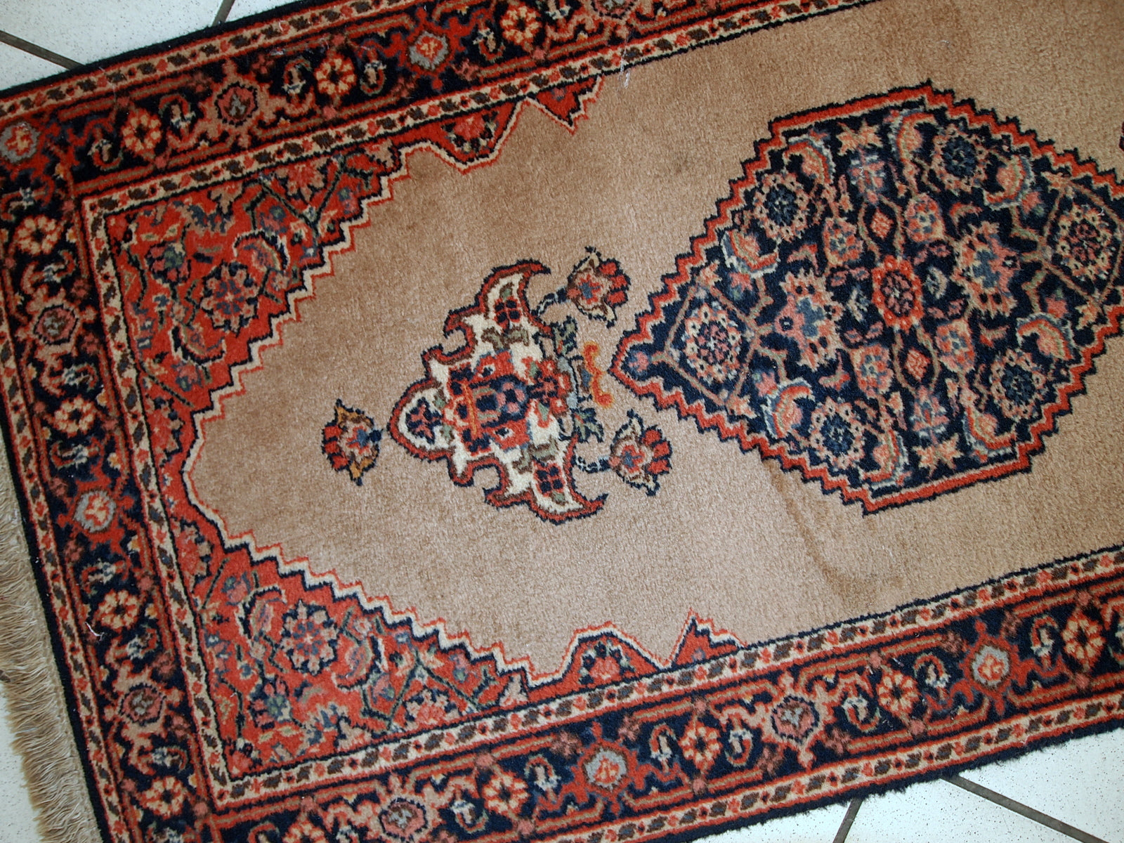 Vintage handmade Indo-Tabriz rug in original good condition. This rug has been made in the middle of 20th century in India.