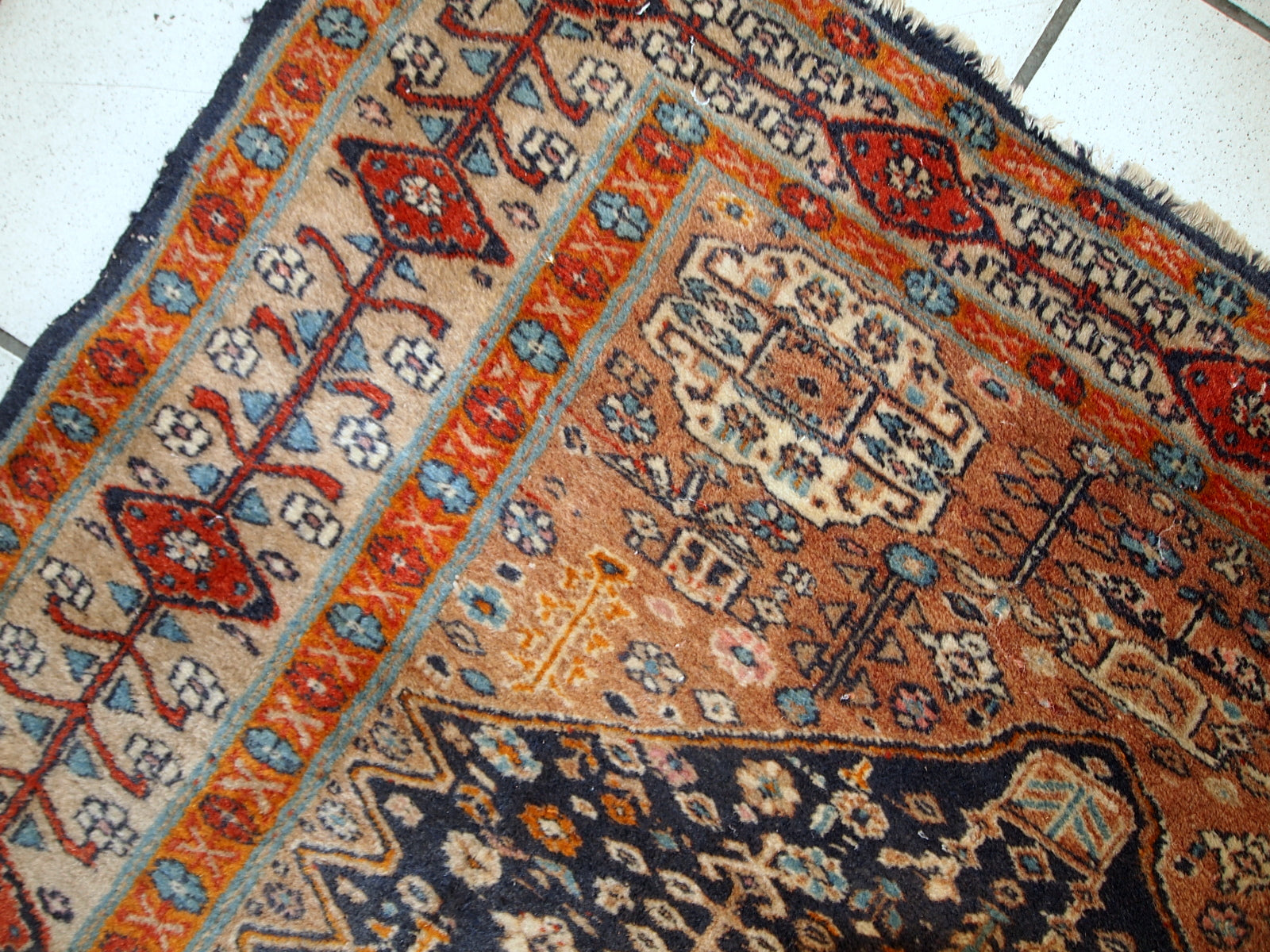 Handmade antique Baluch rug from Central Asia in original condition, it has some age wear. The rug is from the beginning of 20th century.