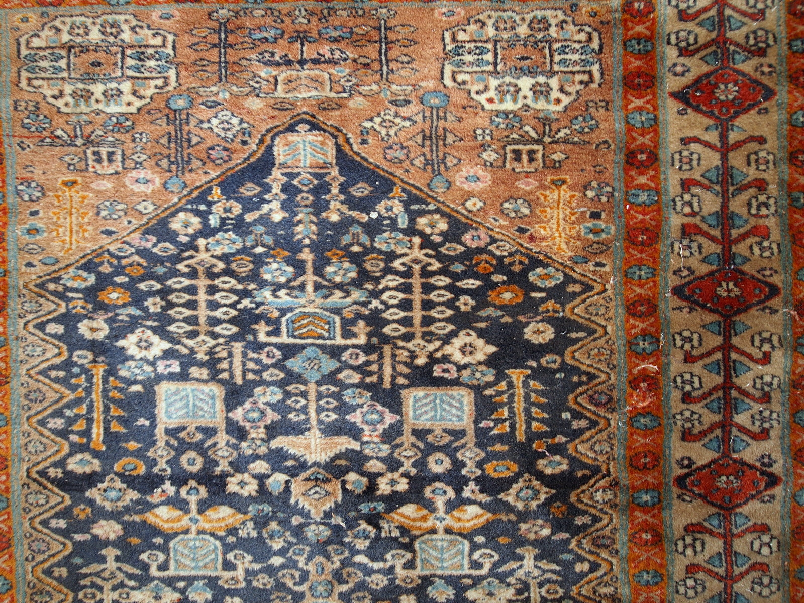 Handmade antique Baluch rug from Central Asia in original condition, it has some age wear. The rug is from the beginning of 20th century.