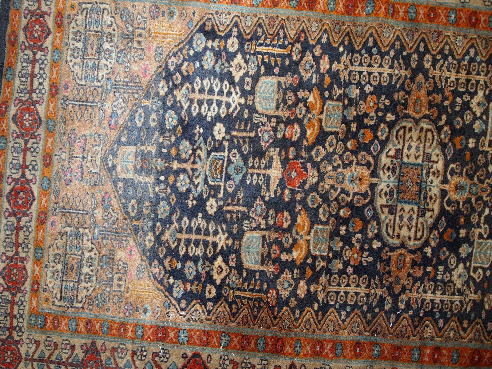 Handmade antique Baluch rug from Central Asia in original condition, it has some age wear. The rug is from the beginning of 20th century.