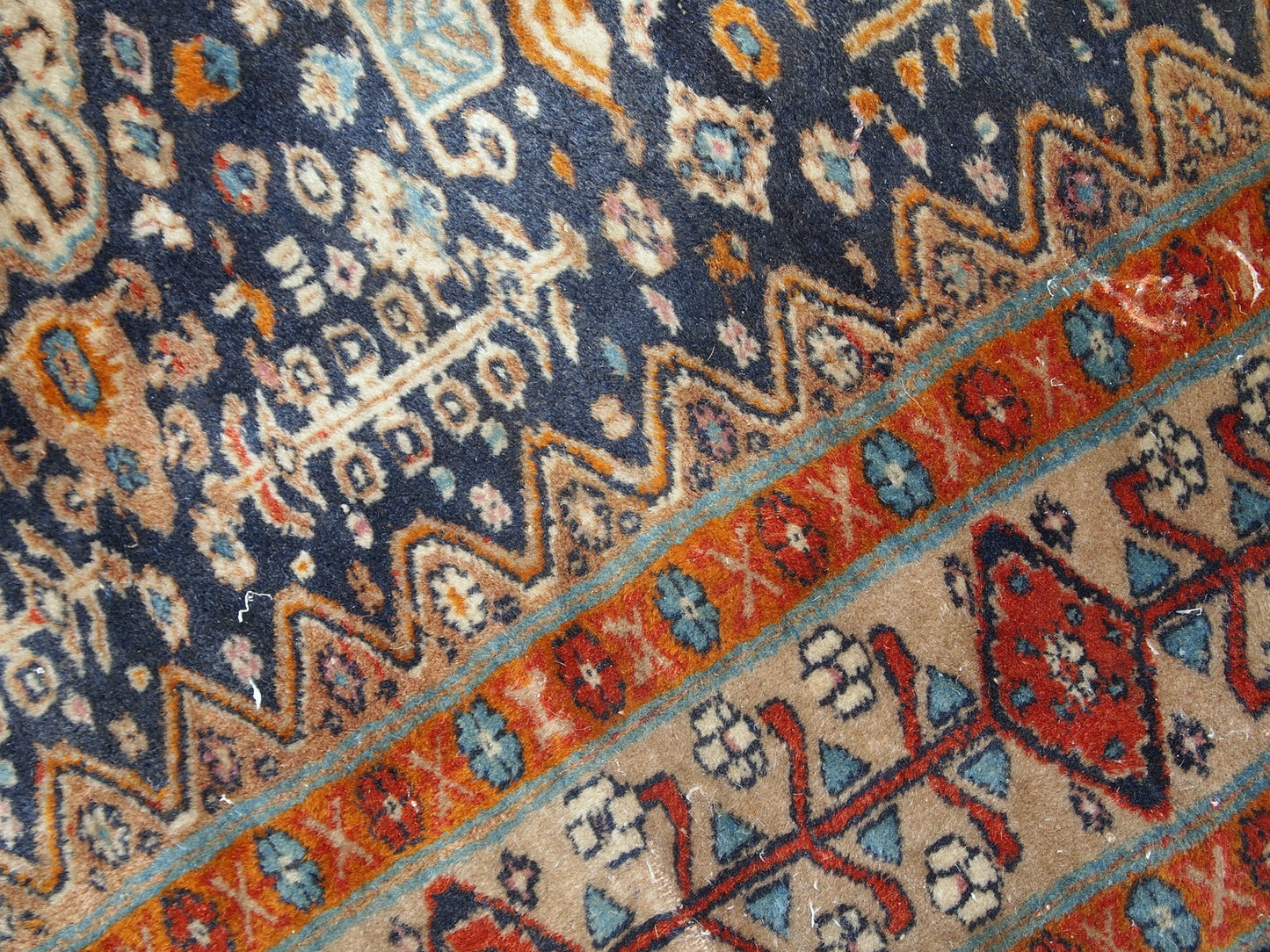 Handmade antique Baluch rug from Central Asia in original condition, it has some age wear. The rug is from the beginning of 20th century.
