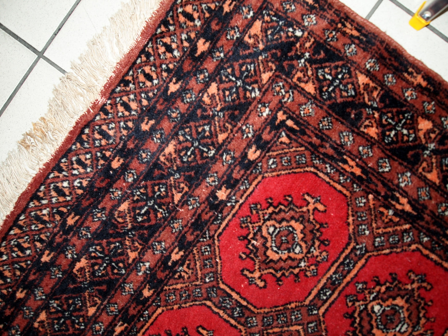 Handmade vintage Uzbek Bukhara rug in original good condition. The rug made in soft wool in the middle of 20th century. 
