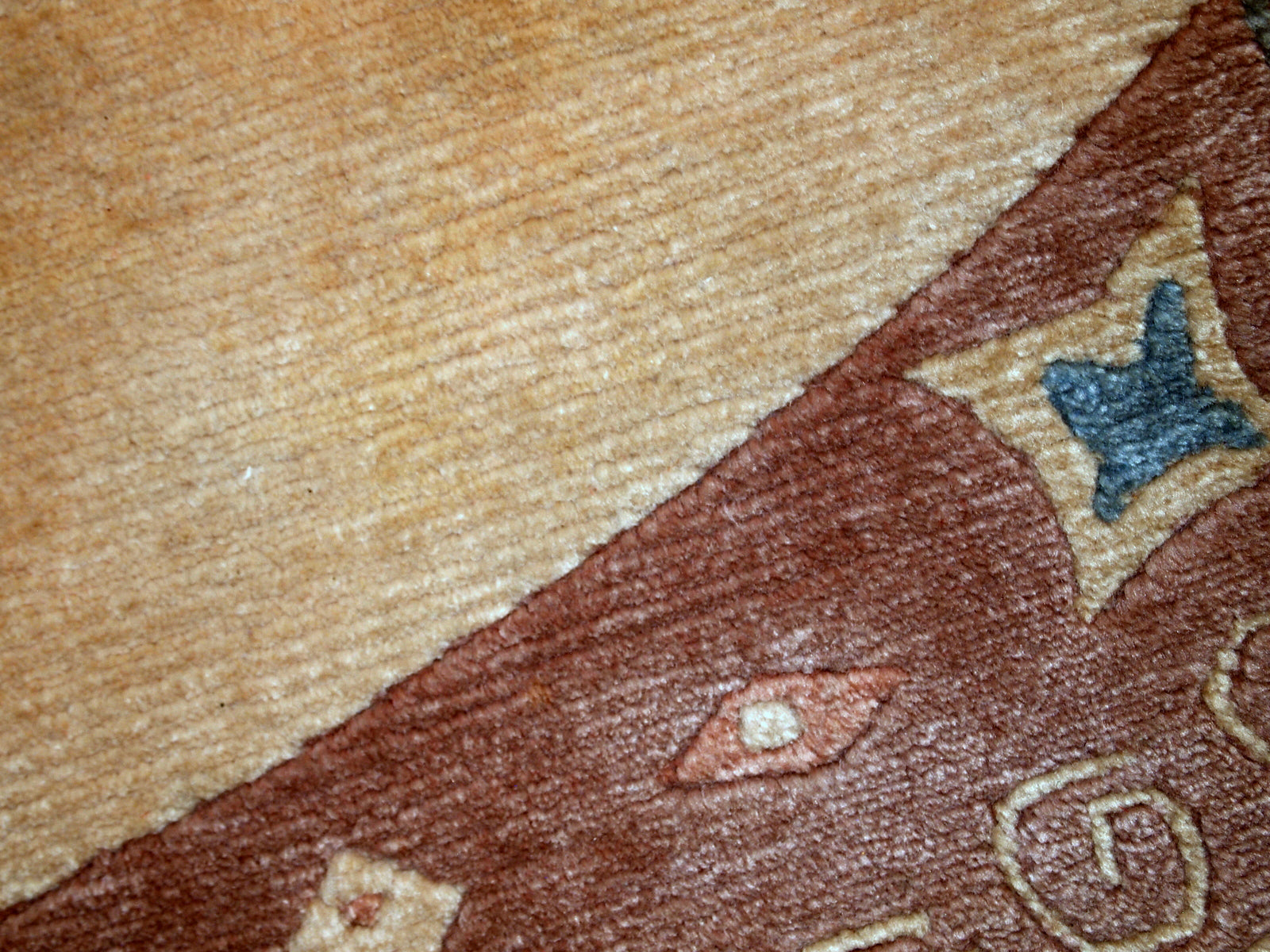 Handmade vintage Tibetan Khaden rug in original good condition. The rug has full pile, made in geometric design in beige shade. The rug is heavy.