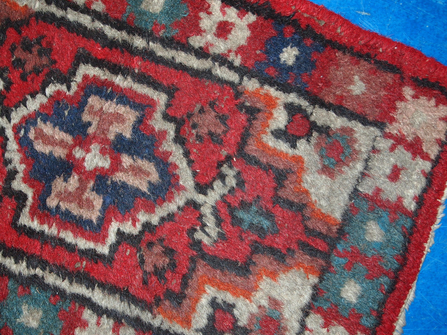 Vintage handmade Middle Eastern mat in original condition, it has some age wear. The rug is from the end of 20th century.